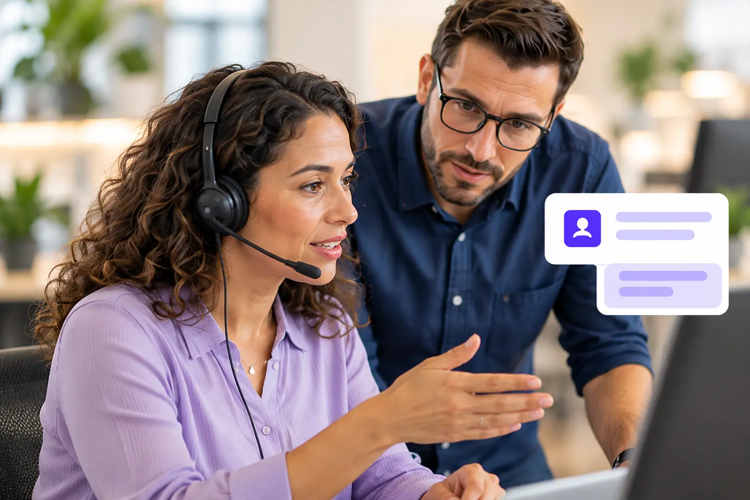 A customer service colleague consulting a teammate about a customer issue.